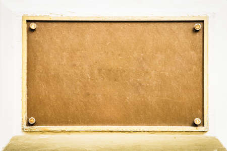 blank sign at a wall - nice background with space for textの写真素材