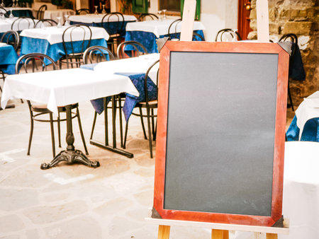 empty black board (menu board) at a restaurant - nice backgroud with space for textのeditorial素材
