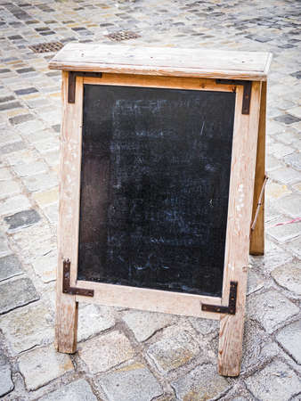 empty black board (menu board) at a restaurant - nice backgroud with space for textの写真素材