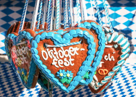 typical souvenir at the oktoberfest in munich - a gingerbread heartの写真素材