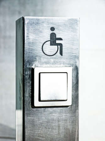 disabled sign at a door openerの写真素材