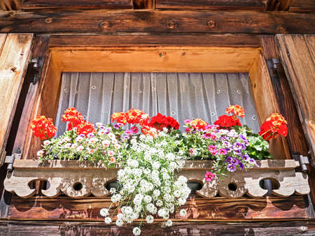 window at a typical old bavarian farmhouseの写真素材