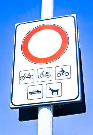 road closed sign in front of sky