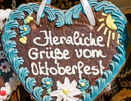 typical souvenir at the oktoberfest in munich - a gingerbread heartの写真素材