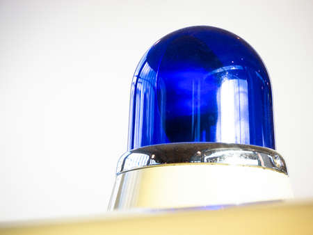 blue light at an old police carの写真素材