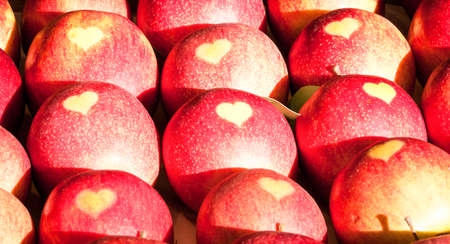 apples with heart at a farmers marketの写真素材