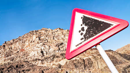 rock slide sign - warning signの写真素材
