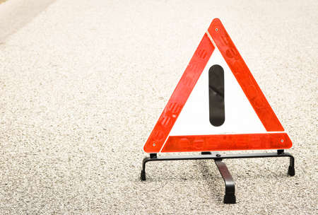 warning triangle at a streetの写真素材