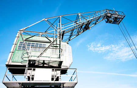 old crane at a harborの写真素材