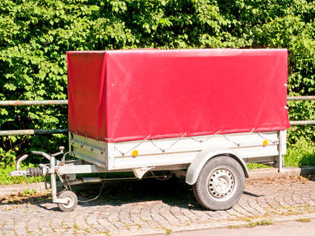 red trailer at a parking lotの写真素材
