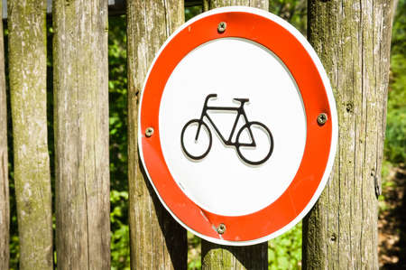 no bikes sign at an old fenceの写真素材