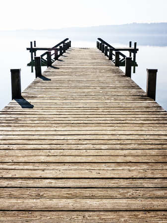 old wooden jetty at a lakeの写真素材