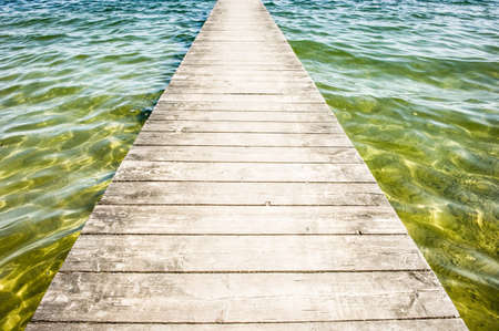 old wooden jetty at a lakeの写真素材