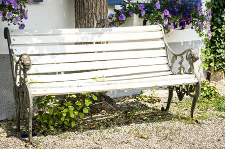 old wooden park bench at a backyardの写真素材
