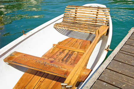 old wooden rowboat at a lake
