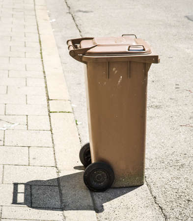 modern garbage bins at a sidewalkの写真素材