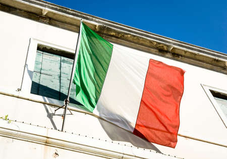 italian flag at a historic buildingの写真素材