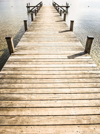 old wooden jetty at a lakeの写真素材
