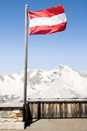 austrian flag at a mountainの写真素材
