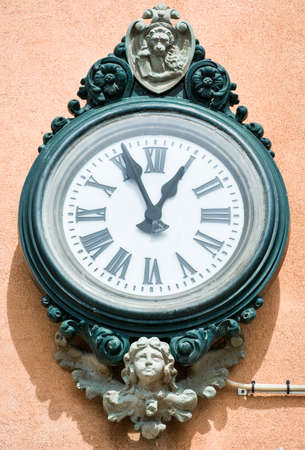 old clock in front of skyの写真素材