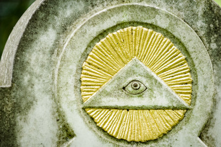 the everything seeing eye at a historic tombstone in munichのeditorial素材