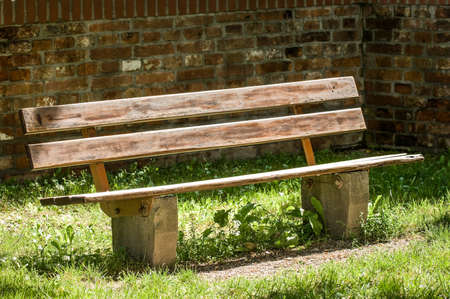 wooden park bench at a parkの写真素材