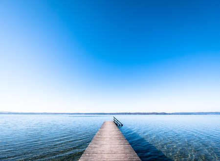 old wooden jetty at a lakeの写真素材