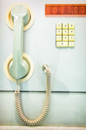 old phone and keypad at a trainの写真素材