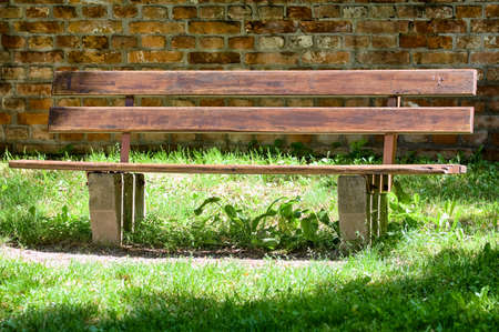wooden park bench at a park