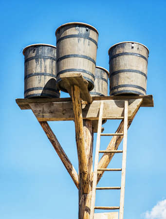old watertower  in front of blue skyの写真素材