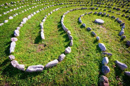 curve of rocks at a meadowの写真素材