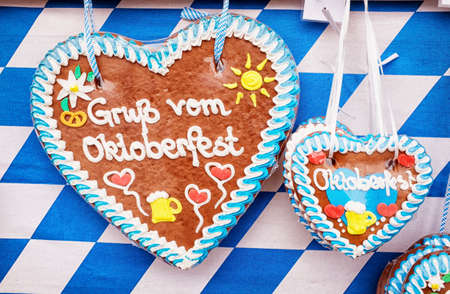 typical souvenir at the oktoberfest in munich - a gingerbread heartの写真素材