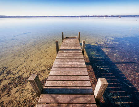 old wooden jetty at a lakeの写真素材