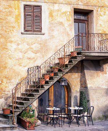 tables and chairs at a bistro in italyのeditorial素材