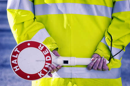german school crossing guard - rear-view - stop! children!