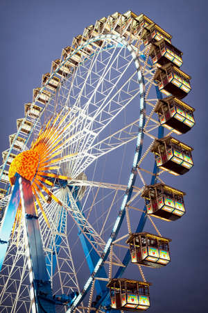 famous ferris wheel at the oktoberfest in munich - germanyの写真素材