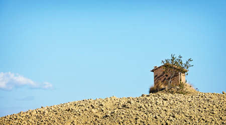 small house on a hillの写真素材