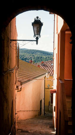 beautiful old arch and a streetlampの写真素材