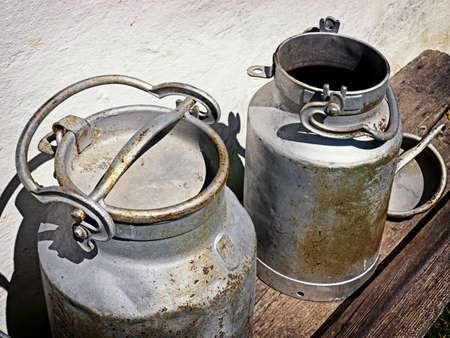 old milk canisters at a farmの写真素材