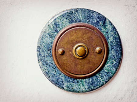 old bell button at a wallの写真素材