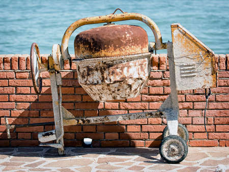 old concrete mixer at a lakeの写真素材