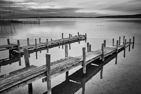 old wooden jetty at a lakeの写真素材