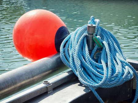 red buoy at a fishing trawler