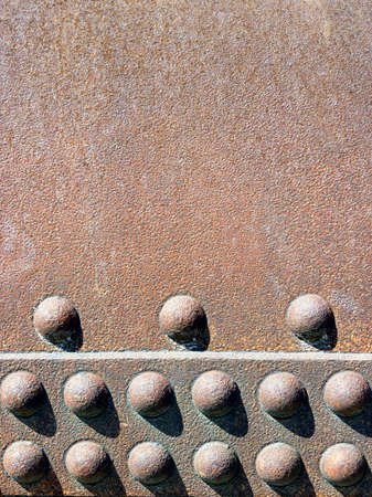 rusty iron background with rivets