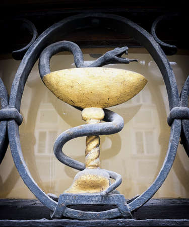 Aesculapian staff - Caduceus at a historic gravestoneの写真素材