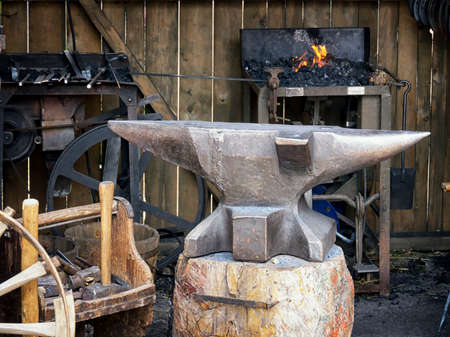 antique workshop with anvil and forge