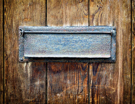 old letterbox at a front doorの写真素材