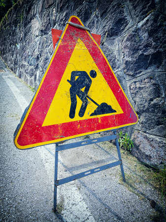 men at work sign at a construction siteの写真素材