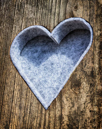 wooden heart at an antique restroom-door