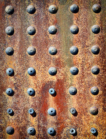rusty iron background with rivetsの写真素材